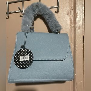 Blue purse with fluffy handle